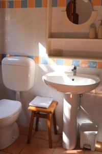 a bathroom with a sink and a toilet at Casa Adriana - Costa Paradiso in Costa Paradiso