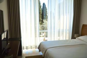 Voodi või voodid majutusasutuse Hotel L'Approdo toas
