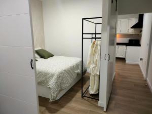 Ένα ή περισσότερα κρεβάτια σε δωμάτιο στο Apartamento El Adoquín