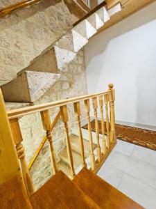 a staircase in a building with a stone wall at Apartment Zakrjan in Old town Korčula in Korčula