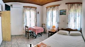 Postel nebo postele na pokoji v ubytování Angelos Rooms