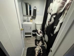 a bathroom with a dog on a rug on the floor at Nice 3 bedrooms apt 4 lovely group family 25 mins 2 NY City in North Bergen +63 photos