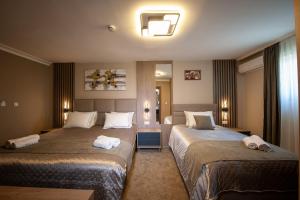 Uma cama ou camas num quarto em Hotel Kralj