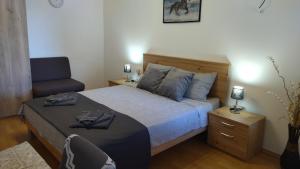 Postel nebo postele na pokoji v ubytování Apartment Uki