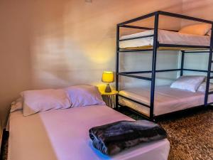 Postel nebo postele na pokoji v ubytování Fardo Hotel Boutique en Ibague - Zona G - Recepción Digital 24H