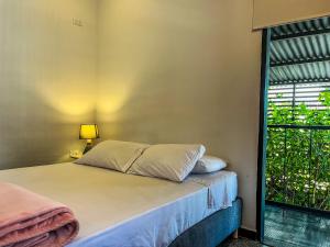 Postel nebo postele na pokoji v ubytování Fardo Hotel Boutique en Ibague - Zona G - Recepción Digital 24H