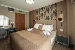 Uma cama ou camas num quarto em Hotel Kralj