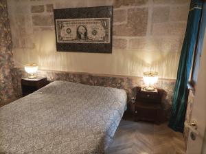 Posteľ alebo postele v izbe v ubytovaní Maison intra muros, terrasses avec vue jaccuzzi et garage