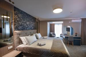 Uma cama ou camas num quarto em Hotel Kralj