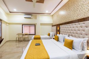 Postel nebo postele na pokoji v ubytování Hotel New Imperial