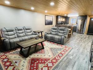 a living room with couches and a table and a kitchen at Dolly's # 2 condo in Sevierville