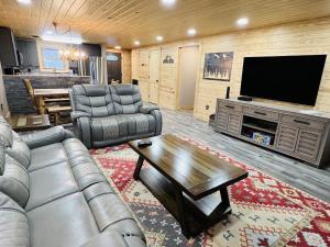 a living room with a couch and a television at Dolly's # 2 condo in Sevierville