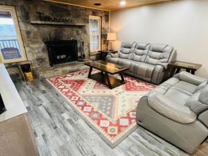 a living room with a couch and a fireplace at Dolly's # 2 condo in Sevierville