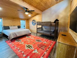 a bedroom with a bed and a red rug at Dolly's # 2 condo in Sevierville