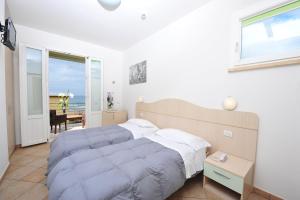 Кровать или кровати в номере Hotel Aurora