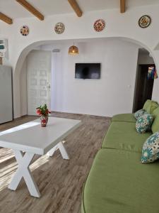 a living room with a couch and a table at Seva's House in Psinthos