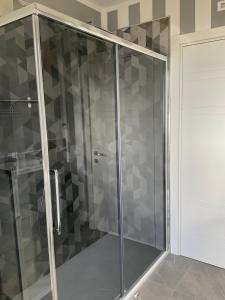 a shower with a glass door in a bathroom at Casa vista mare in Corsanico-Bargecchia +46 photos