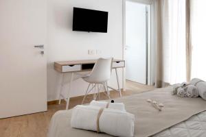 TV a/nebo společenská místnost v ubytování Le Nereidi Green Resort Filippo