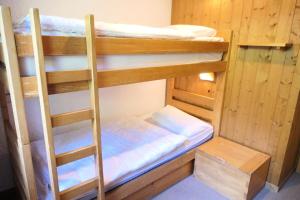 a couple of bunk beds in a room at Résidence Les Planes - 4 Pièces pour 8 Personnes 06 in Saint-Gervais-les-Bains