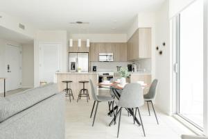 a kitchen and living room with a table and chairs at Desing district, great apartment in Miami