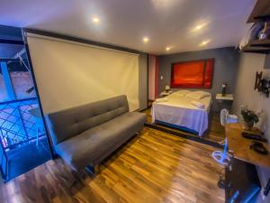 Postel nebo postele na pokoji v ubytování Fardo Hotel Boutique en Ibague - Zona G - Recepción Digital 24H