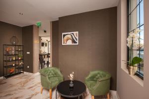 Uma área de estar em Hotel Kralj