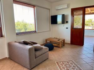 TV a/nebo společenská místnost v ubytování Alloggio Vistamare