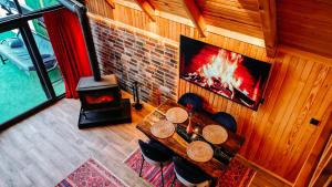 an overhead view of a living room with a fireplace at Aurora Suit Bungalov in Rize