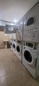 a row of washing machines in a laundry room at Casa de Moneda Downtown in Santiago
