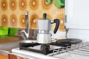 a coffee pot sitting on top of a stove at Casa di Nonna Linda in Portocannone