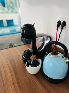 a tea kettle and a cup on a table at Marcel Zadar City Center in Zadar