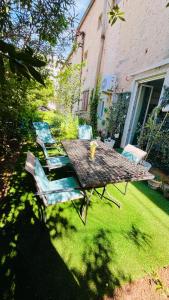 a picnic table and chairs in a yard at Marcel Zadar City Center in Zadar