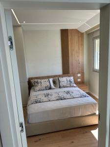 a bedroom with a large bed in a room at Sea Scape Apartment 3 in Vlorë +13 photos