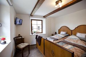 Postel nebo postele na pokoji v ubytování Pension Alte Schmiede