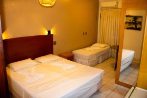 Postel nebo postele na pokoji v ubytování Hotel Pousada Azzurra