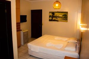 Postel nebo postele na pokoji v ubytování Hotel Pousada Azzurra