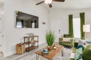 a living room with a couch and a table at Retreat at the Oasis in Pensacola