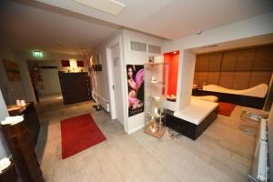 A bed or beds in a room at Hotel Fedora Riccione