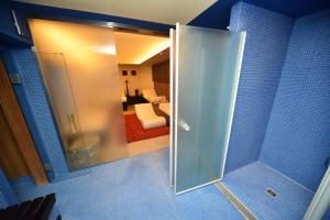 A bed or beds in a room at Hotel Fedora Riccione