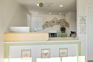 a kitchen with a counter with a laptop on it at Gateway Lodge in Seaside