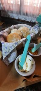 a tray of food with a basket of bread and dip at Umbrella 1 in La Rioja