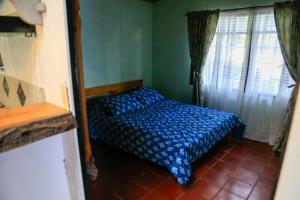 Krevet ili kreveti u jedinici u okviru objekta Casa de Campo en la Montaña Negra-Subachoque