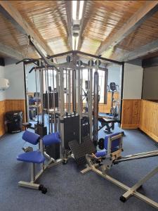 a gym with several treadmills and machines in it at Caravan near Port Carlisle in Aikton