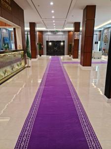 a purple carpet in the middle of a hallway at فندق روزميلون in Sakakah