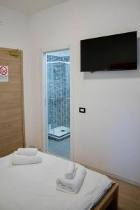 Voodi või voodid majutusasutuse Genova Suite toas