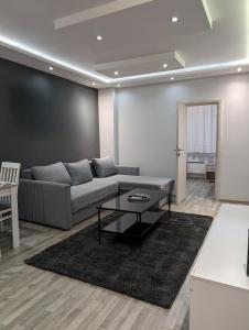 a living room with a couch and a table at Top Belgrade Apartments in Belgrade