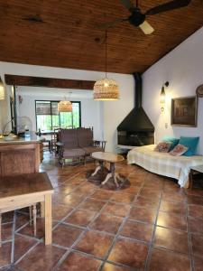 a living room with a bed and a fireplace at Casa BAUM in Yerba Buena