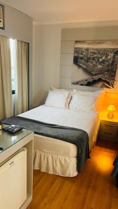 Postelja oz. postelje v sobi nastanitve Flat de Luxo Aeroporto Congonhas - Hotel eSuites