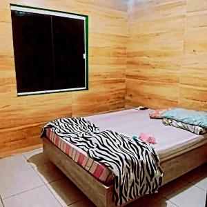 Katil atau katil-katil dalam bilik di Casa com piscina