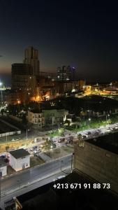 a view of a city at night with lights at Fernand ville Oran in Oran